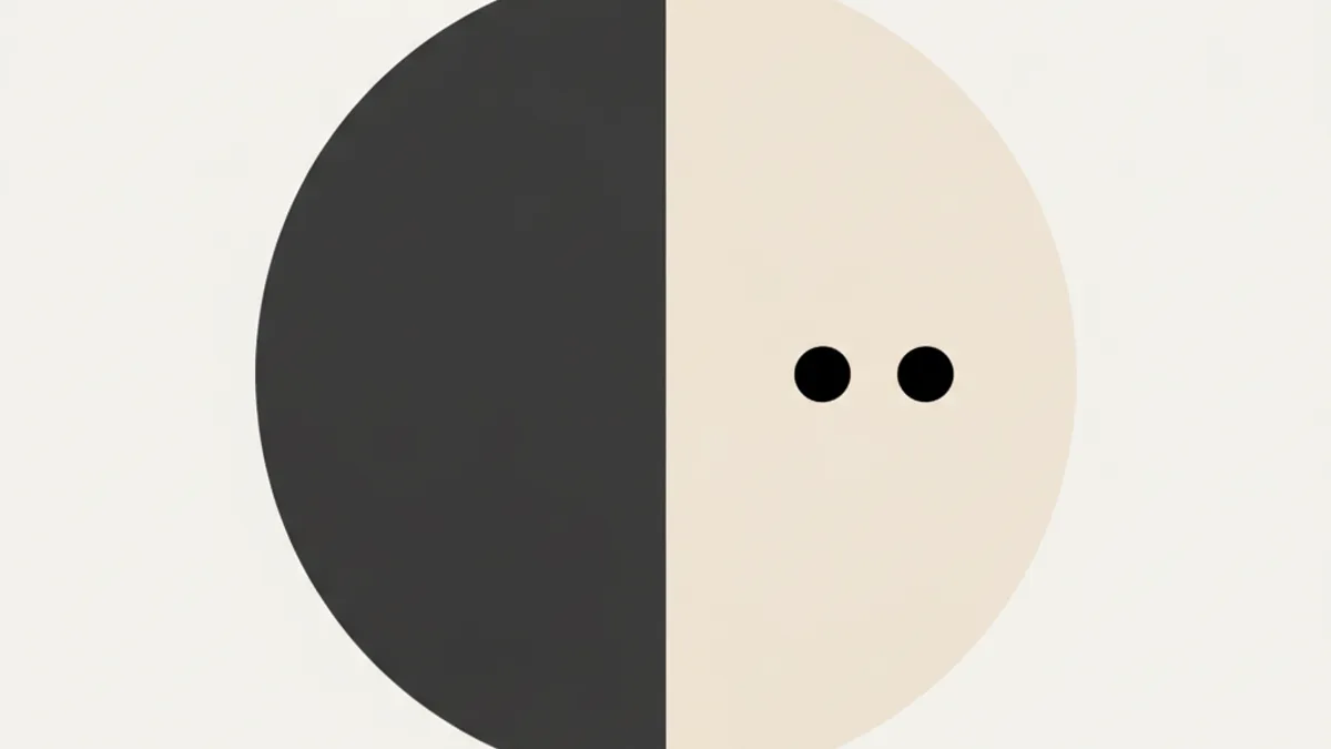 Diagram: a circle vertically divided into a dark and a light half, with two small black dots on the light side